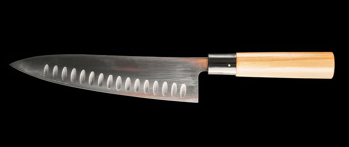 Gyuto is a traditional Japanese chef's knife, suitable for cutting meat, fish, and vegetables