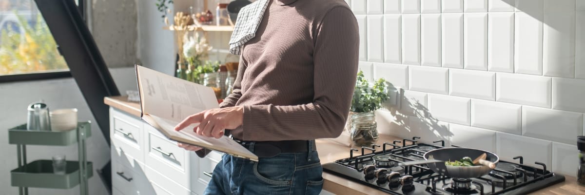 Reading cookbooks in the kitchen